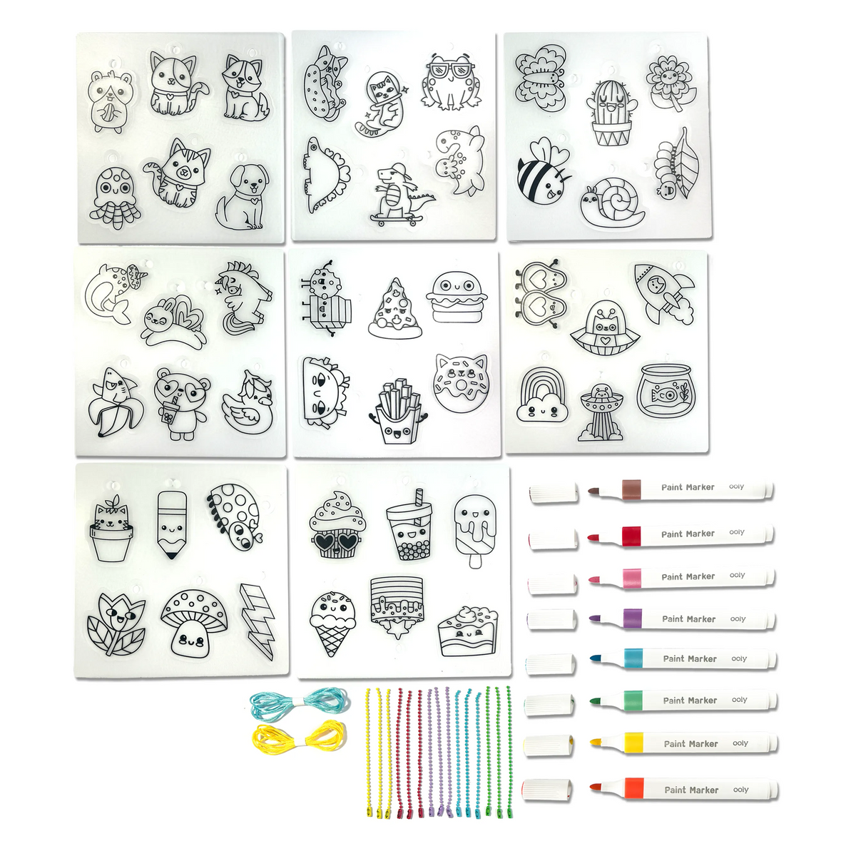 Set of clear stamps with various designs and colorful markers on a white background
